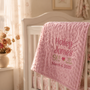 Embroidered birth stats blanket with a baby's name, date, weight, and length stitched in soft minky fabric.