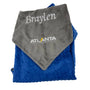 Folded gray and blue blanket with 'Braylen' and 'Atlanta Lightning' branding on a white background