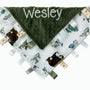 Baby blanket with green minky fabric and animal pattern on a white background