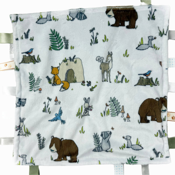 Baby blanket with forest animal illustrations on a white background