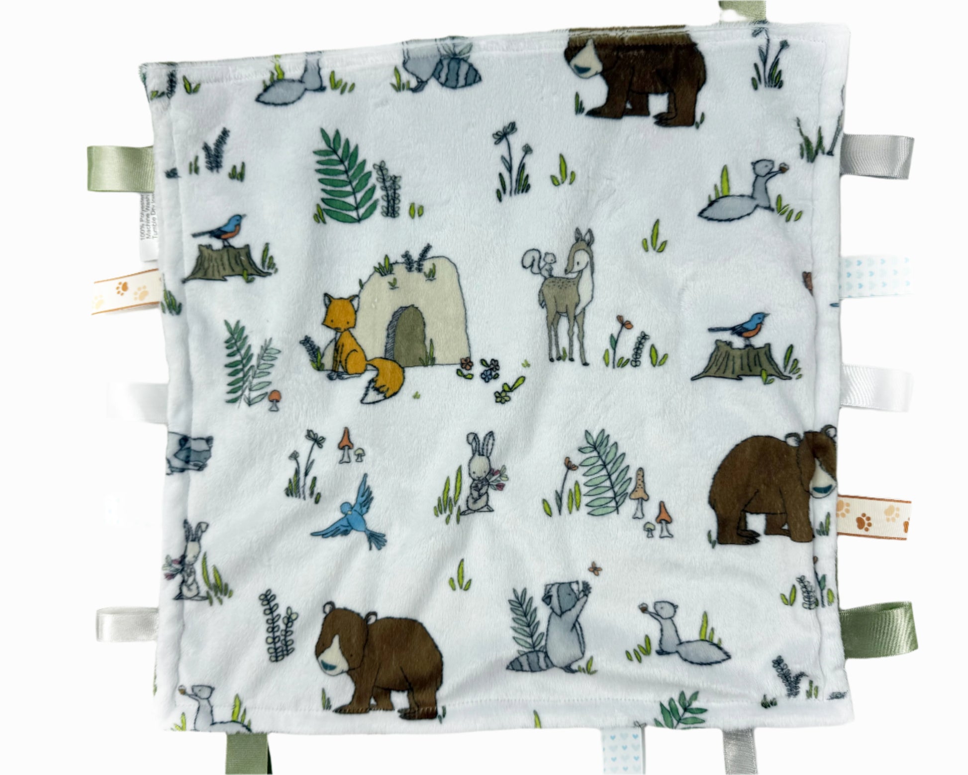 Baby blanket with forest animal illustrations on a white background