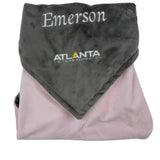 Folded gray and pink blanket with 'Emerson' and 'Atlanta Lightning' branding on a white background