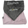 Folded gray and pink blanket with 'Emerson' and 'Atlanta Lightning' branding on a white background
