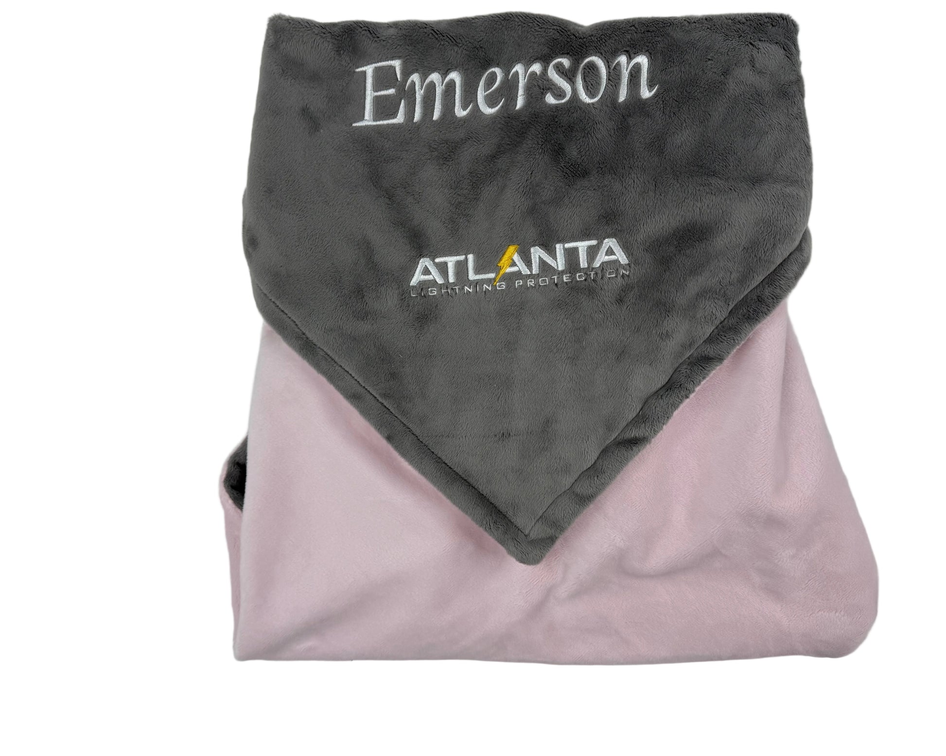 Folded gray and pink blanket with 'Emerson' and 'Atlanta Lightning' branding on a white background