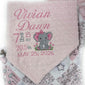 Baby blanket with personalized text and elephant design on a pink background