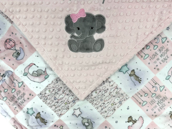 Baby blanket with elephant design and 'Hadley' text on a pink background