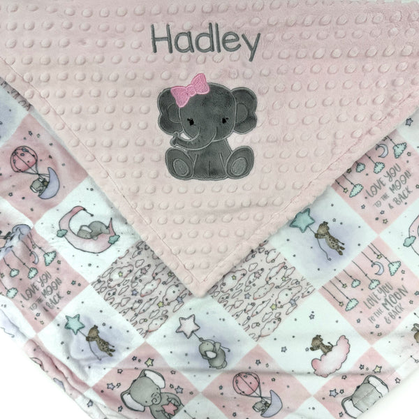 Baby blanket with elephant design and 'Hadley' text on a pink background