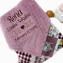 Pink baby blanket with personalized text on a white background