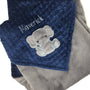 Baby blanket with a gray elephant applique and name in gray. This blanket has navy dimple dot on one side with the elephant and name. The other side is smooth graphite gray minky. This is a beautiful soft blanket for baby to snuggle.