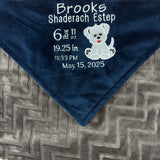 Navy blue and gray blanket with embroidered baby birth stats and a puppy applique in white