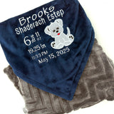 Navy blue and gray blanket with embroidered baby birth stats and a puppy applique in white