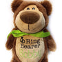 A brown plush teddy bear with a green bow ribbon around its neck, featuring a label with the text 'Ring Bearer Bobby'.